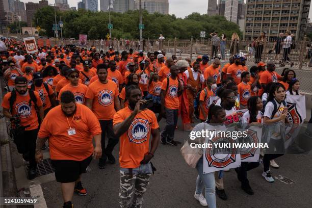 Community leaders and activists march across the Brooklyn Bridge during the citywide Gun Violence Awareness March in New York on June 2, 2022.