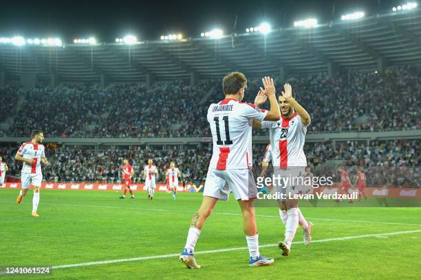 Saba Lobzhanidze of Georgia and Georges Mikautadze of Georgia celebrate their goal during the UEFA Nations League League C Group 4 match between...