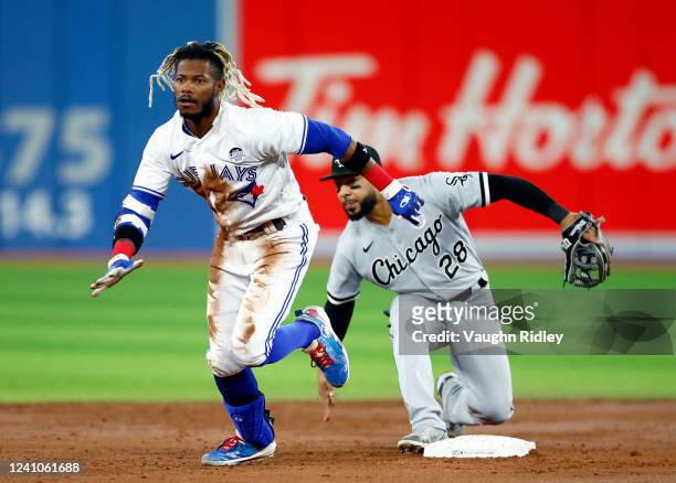 Raimel Tapia of the Toronto Blue Jays runs to third base on a throwing error by Gavins Sheets of the Chicago White Sox in the third inning during a...