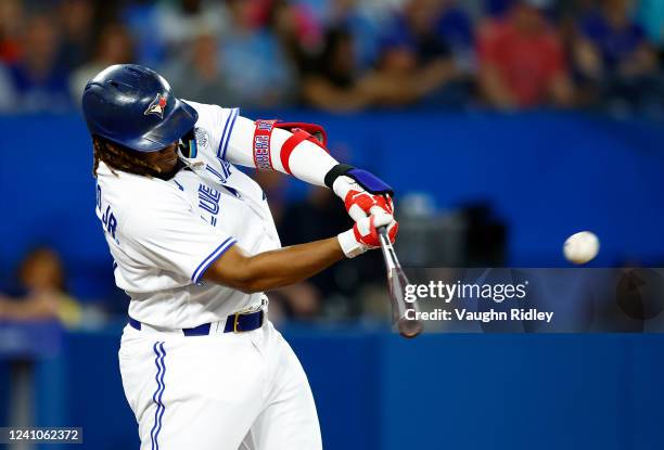 Vladimir Guerrero Jr. #27 of the Toronto Blue Jays hits a double in the sixth inning during a MLB game against the Chicago White Sox at Rogers Centre...