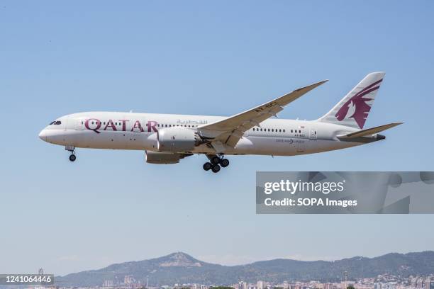 Qatar Airways airplane is seen landing at El Prat Airport.