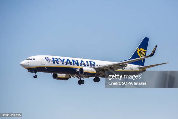 Ryanair airplane is seen landing at El Prat Airport.