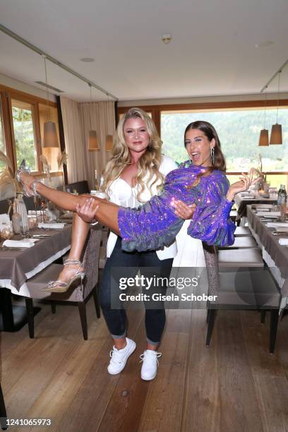 Sophia Thiel carries Cathy Hummels during the Strong Mind Retreat Charity Gala by Cathy Hummels at Kronthaler Hotel on June 2, 2022 in Achenkirch,...