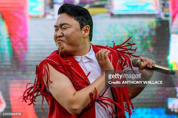 In this picture taken on May 27 South Korean singer and producer Psy performs during a concert at an outdoor venue in the grounds of the Korea...