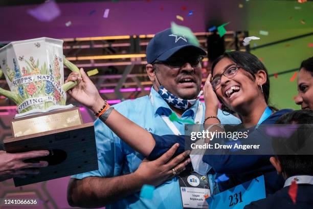 Year-old Harini Logan from San Antonio, Texas is embraced by family after winning the Scripps National Spelling Bee at the Gaylord National Harbor...