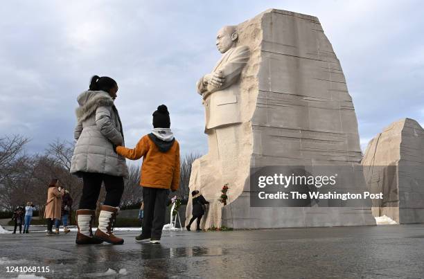 Melanie Harris and her son, Joshua Harris of Arlington, VA visit the Martin Luther King Jr. Memorial on Monday January 17, 2022 in Washington, DC....