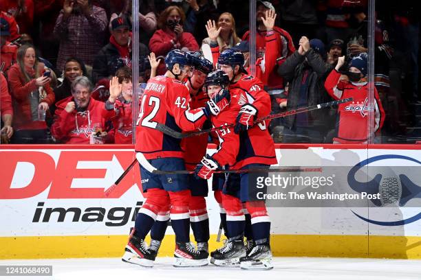 Washington Capitals celebrate the first goal of the game scored by Washington Capitals center Connor McMichael and assisted by newby Washington...