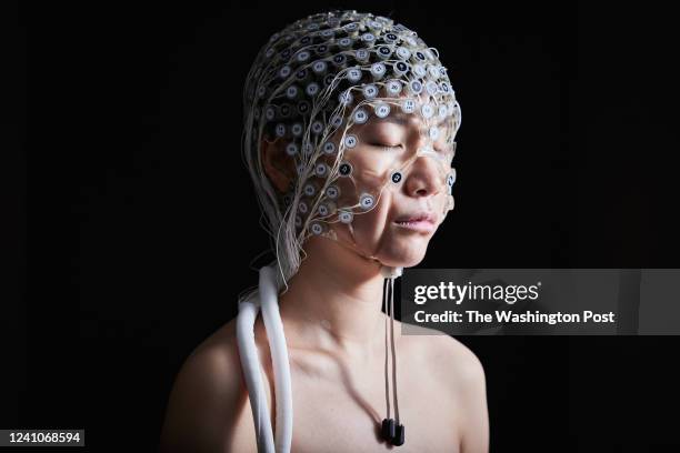 May 19th, 2022: At BEL in Eugene, OR Research Laboratory Manager and Test Engineer Shijing Zhou poses for a portrait wearing a Geodesic Head Web with...