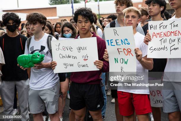 Students from McLean High School participate in a walkout in McLean, Virginia on May 26, 2022 in protest of the mass shootings that have taken place...