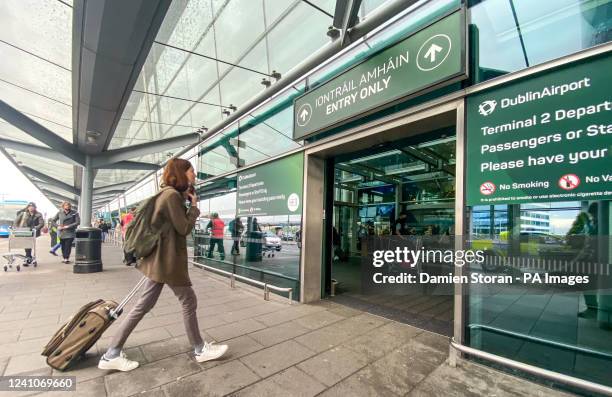 Passengers arrive at Dublin airport on Friday morning as around 200,000 people are set to travel through the airport over the bank holiday weekend...