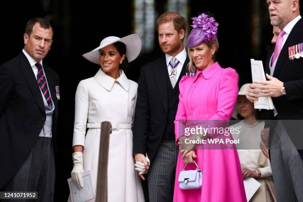 Peter Phillips, Meghan, Duchess of Sussex, Prince Harry, Duke of Sussex, Zara Tindall and her husband Mike Tindall depart after the National Service...