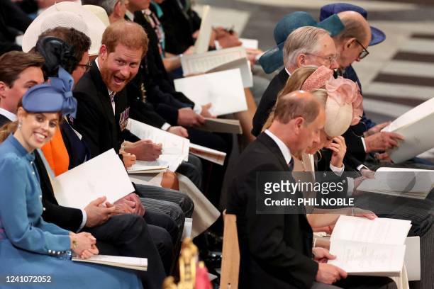 Britain's Prince Harry , Duke of Sussex, grimaces as he waits for the start of the National Service of Thanksgiving for The Queen's reign at Saint...