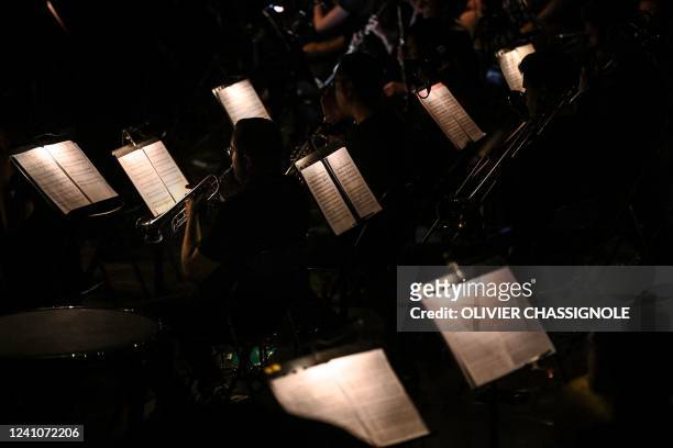 Musicians perform at the Summum concert hall during the Romeo and Juliet Opera in Grenoble, southeastern France, on June 2, 2022. - How can we...