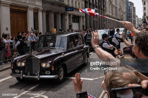 Car carrying Camilla, Duchess of Cornwall and Prince Charles, Prince of Wales arrives at Guildhall for an official reception for dignitaries and...