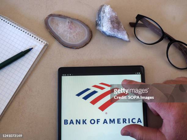 In this photo illustration, a Bank of America logo seen displayed on a tablet.
