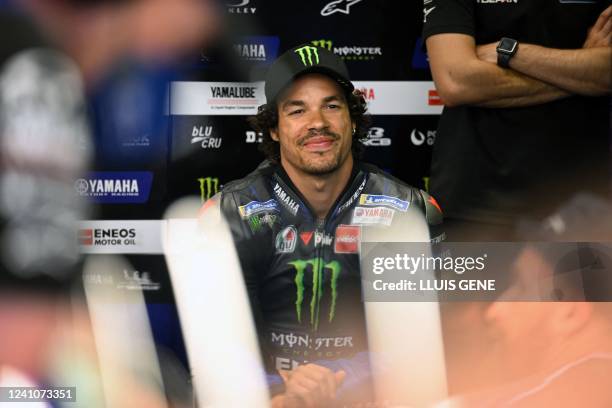 Yamaha Italian rider Franco Morbidelli sits in the box during the second MotoGP free practice session of the Moto Grand Prix de Catalunya at the...