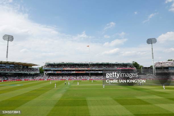 General view of players on the pitch on the second day of the first cricket Test match between England and New Zealand at Lord's cricket ground in...