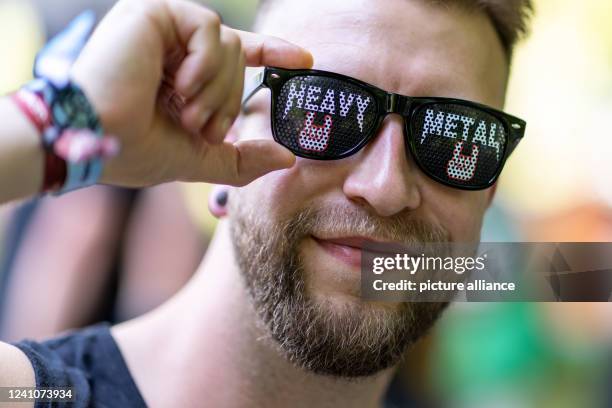 June 2022, Bavaria, Nuremberg: "Heavy Metal" is written on Marcel's glasses at the open-air festival "Rock im Park". It is one of the biggest music...