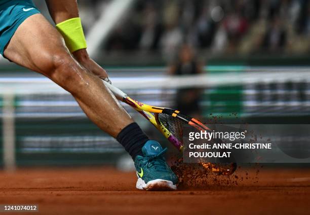 Spain's Rafael Nadal slides on the clay as he plays against Germany's Alexander Zverev during their men's semi-final match on day 13 of the...
