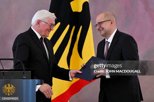 German President Frank-Walter Steinmeier hands the certificate of appointment to Heinrich Amadeus Wolff, new judge at the German Federal...