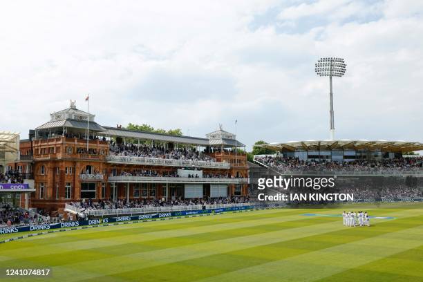 England players are seen during a drink break in front of the pavilion on the second day of the first cricket Test match between England and New...
