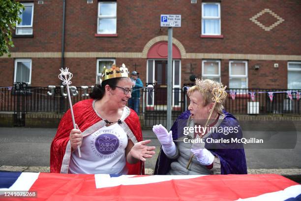 Two residents dressed as the Queen at a street party on Donegall Pass on June 3, 2022 in Belfast, United Kingdom. The Platinum Jubilee of Elizabeth...