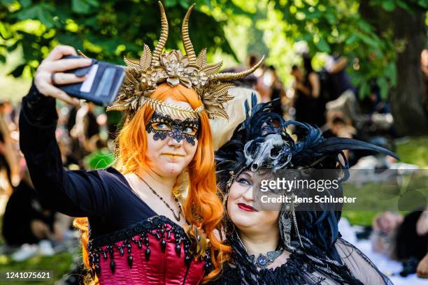 Costumed participants gather for a Victorian picnic in Clara Zetkin park on the first day of the annual WGT Wave Gotik Treffen on June 3, 3022 in...