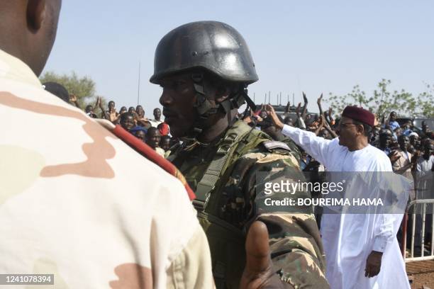 The President of Niger, Mohamed Bazoum , waves during a visit on June 2, 2022 to the city of Makalondi, southwestern Niger, in the middle of the...