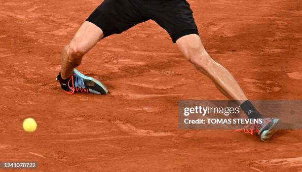 The feet of Germany's Alexander Zverev are pictured as he falls injured on court during his men's semi-final singles match against Spain's Rafael...