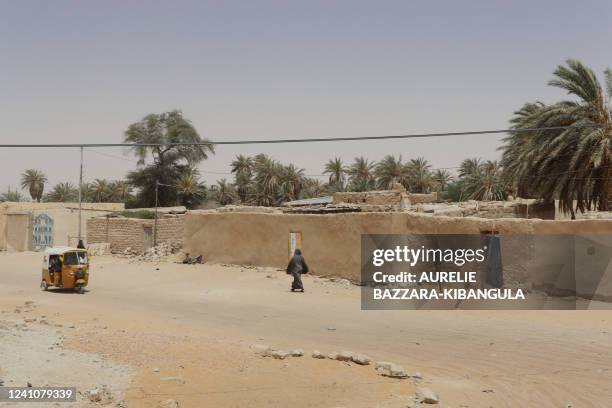 Rackcha, a motorized public transport, passes in a street of Faya-Largeau, in the north of Chad, on June 2, 2022.