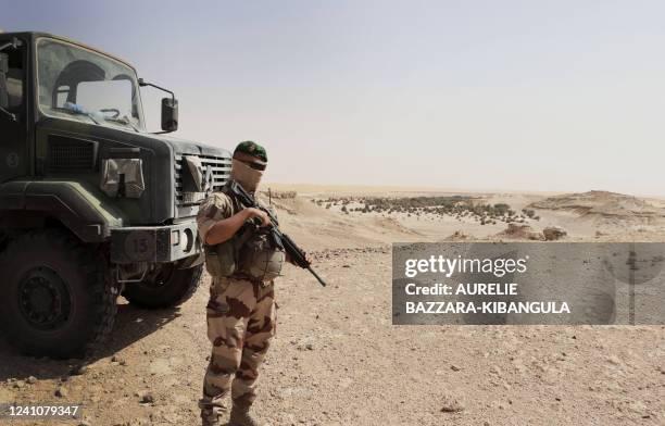 French soldier from the Barkhane force patrols on the Borkou plateau overlooking the palm groves of Faya-Largeau, in northern Chad, on June 2, 2022....