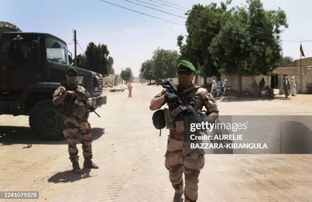 French soldiers from the Barkhane force patrol not far from the central square of Faya-Largeau, in northern Chad, on June 2, 2022. The Barkhane...