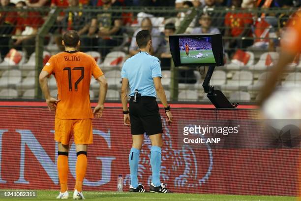 Referee Jose Maria Sanchez watches the footage during the UEFA Nations League match between Belgium and the Netherlands at the King Baudouin Stadium...