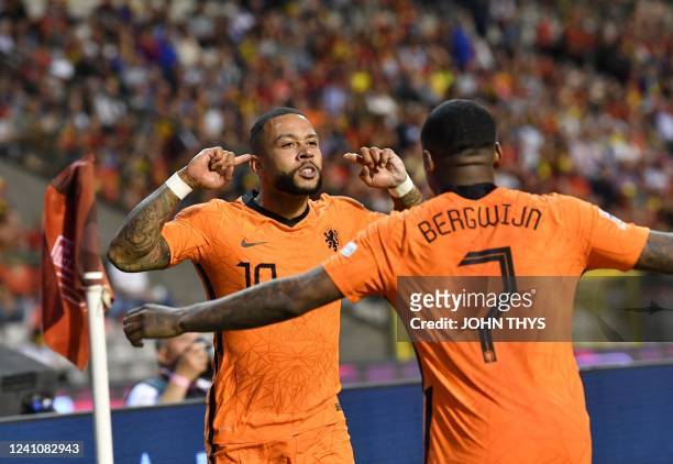 Netherlands' Memphis Depay celebrates after scoring a goal during the UEFA Nations League football match between Belgium and Netherlands at the King...