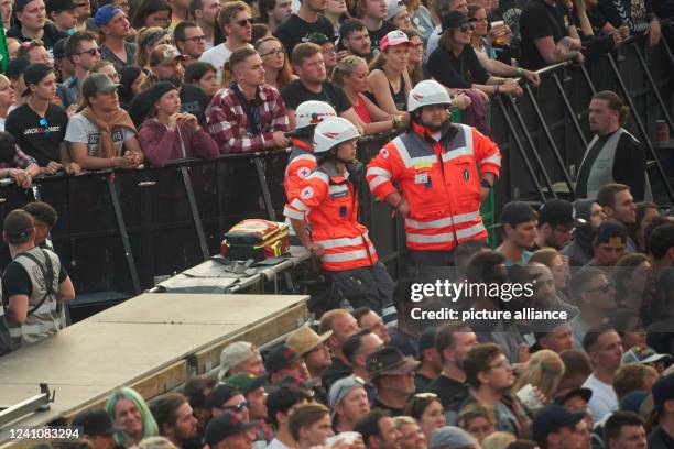 June 2022, Rhineland-Palatinate, Nürburg: Paramedics wait for a mission between the breakwaters in front of the main stage of the open-air rock...