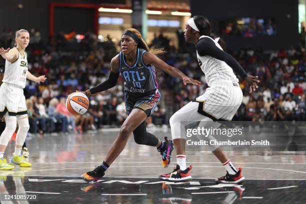 Rhyne Howard of the Atlanta Dream dribbles the ball during the game against the Chicago Sky on June 3, 2022 at Gateway Center Arena in College Park,...