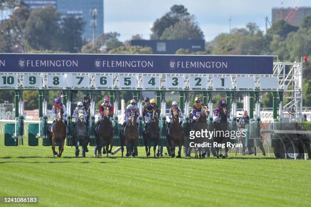 Horses jump at the barriers in the Banjo Paterson Series Handicap at Flemington Racecourse on June 04, 2022 in Flemington, Australia.