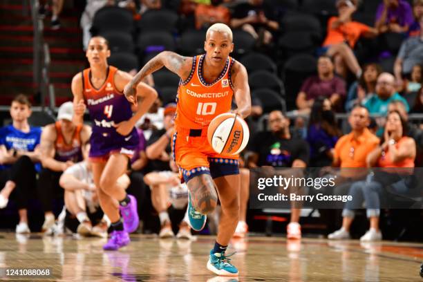 Courtney Williams of the Connecticut Sun dribbles the ball during the game against the Phoenix Mercury on June 3, 2022 at Footprint Center in...