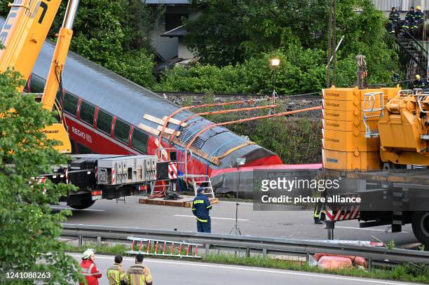 June 2022, Bavaria, Garmisch-Partenkirchen: Emergency and rescue forces are on duty after a serious train accident. Several people have died in a...