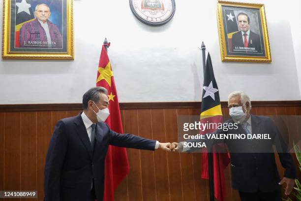 Former East Timorese leader Xanana Gusmao greets Chinese Foreign Minister Wang Yi during a meeting in Dili on June 4, 2022.