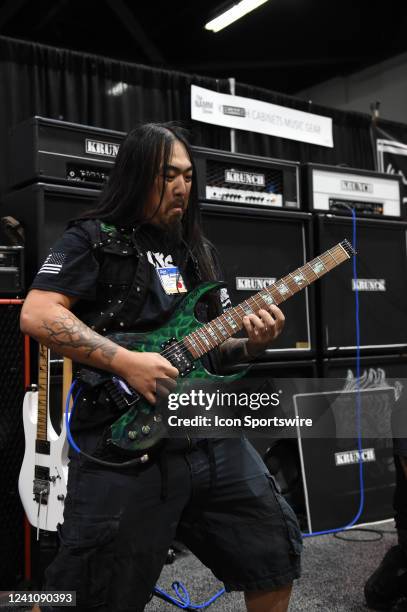 Guitarist Tommy Gibbons performs at the Krunch Kabinets booth during the NAMM Show on June 03 at the Anaheim Convention Center in Anaheim, CA.