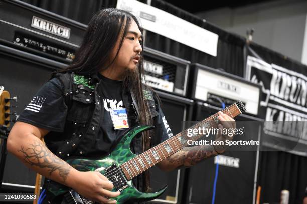 Guitarist Tommy Gibbons performs at the Krunch Kabinets booth during the NAMM Show on June 03 at the Anaheim Convention Center in Anaheim, CA.