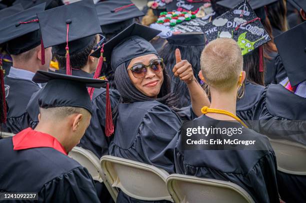 Graduate student seen giving a thumbs up. City College of New York recognized the graduates of the Class of 2022 at their 169th Commencement Ceremony...