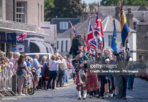 Pipe Major Mark Macrae leads a parade through the town centre during Platinum Jubilee celebrations in Kelso, on day three of the Platinum Jubilee...