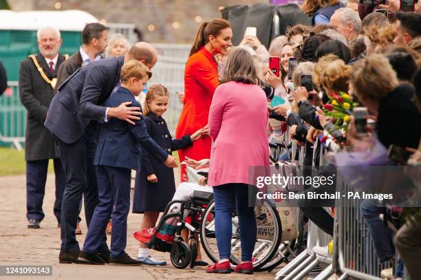 The Duke and Duchess of Cambridge, Prince George and Princess Charlotte speak to wellwishers during their visit to Cardiff Castle to meet performers...