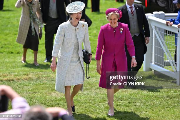 Britain's Princess Anne, Princess Royal shares a joke with Chair of Epsom Racecourse, Julia Budd as they attend the second day of the Epsom Derby...