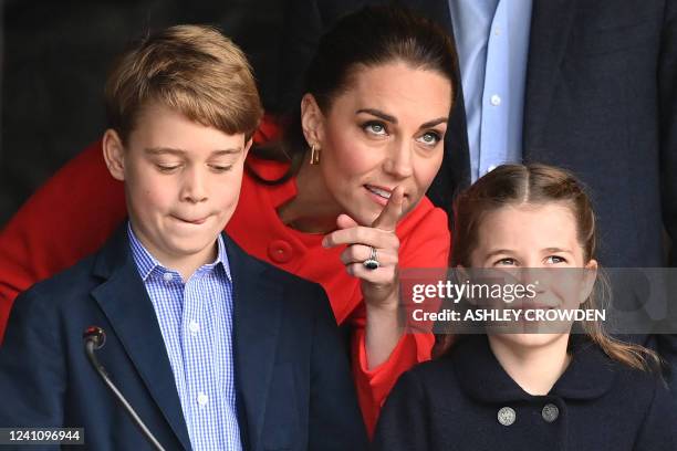 Britain's Catherine , Duchess of Cambridge, speaks to her children Britain's Prince George and Britain's Princess Charlotte during a visit to Cardiff...