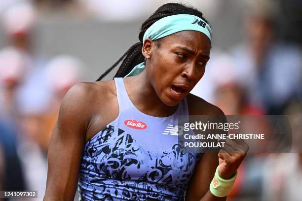 Coco Gauff reacts as she plays against Poland's Iga Swiatek during the women's singles final match, on day fourteen of the Roland-Garros Open tennis...