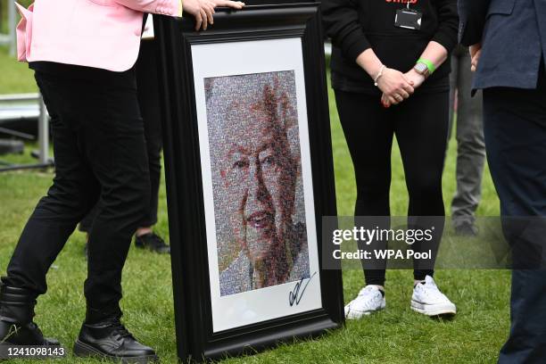 Collage by artist Nathan Wyburn depicting Britain's Queen Elizabeth II is displayed during a visit by the Prince William, Duke of Cambridge and...