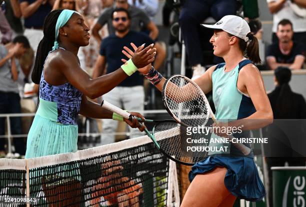Poland's Iga Swiatek shakes hands after victory over US' Coco Gauff in their women's singles final match on day fourteen of the Roland-Garros Open...